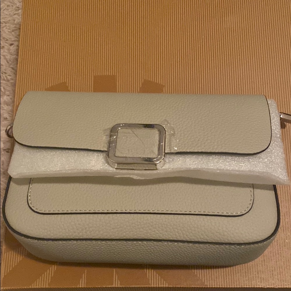 Cream Crossbody Bag with Silver Buckle and Flap Design